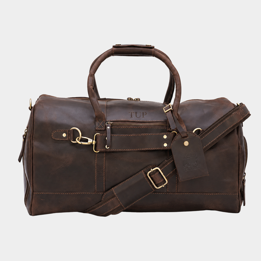 Brown leather travel duffle bag handcrafted from premium full grain leather with adjustable shoulder strap