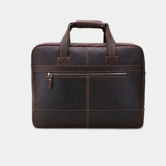 Front view of handcrafted leather messenger bag featuring durable handles and premium stitching.