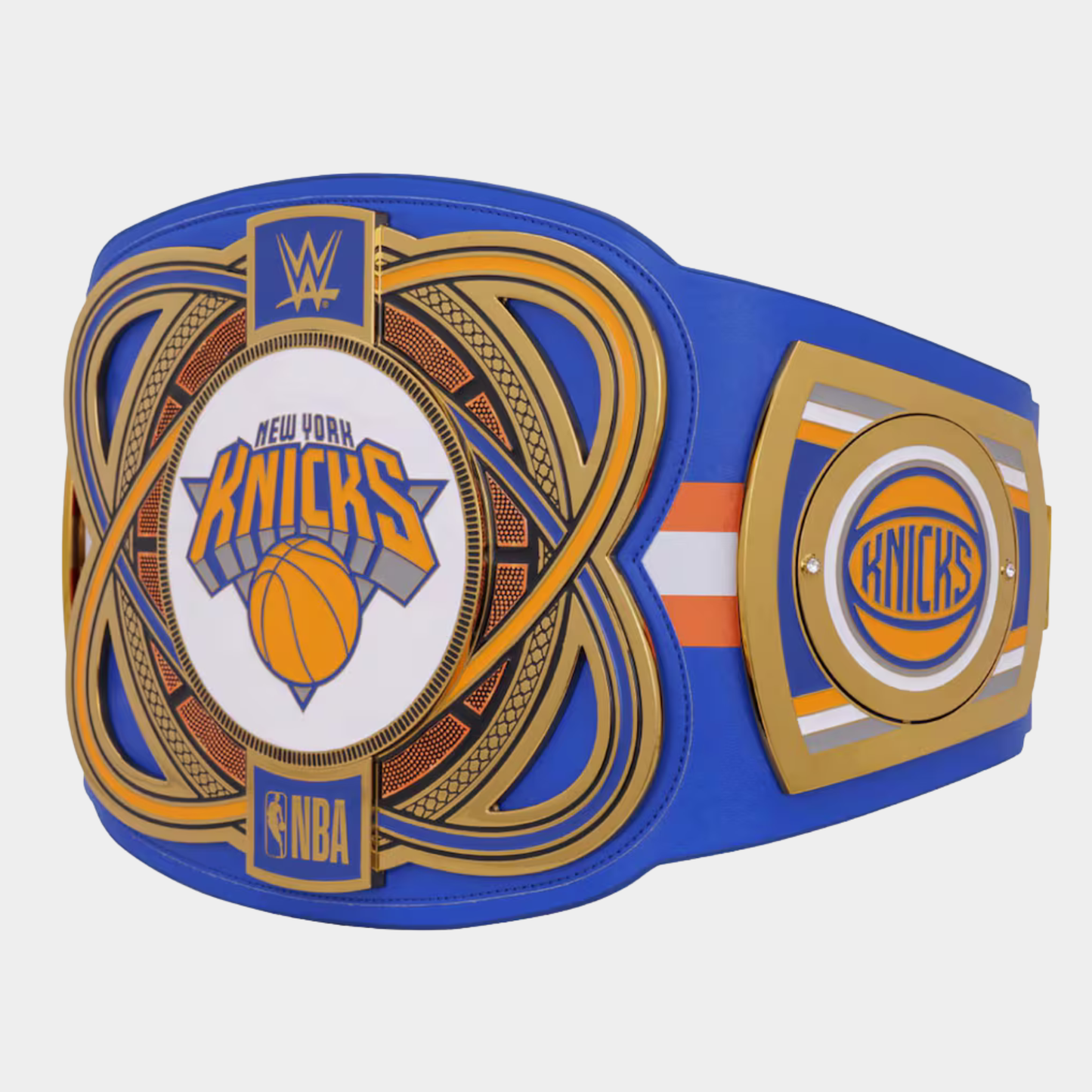 A replica or toy championship belt featuring the New York Knicks logo, with WWE branding, displayed on a light gray background.