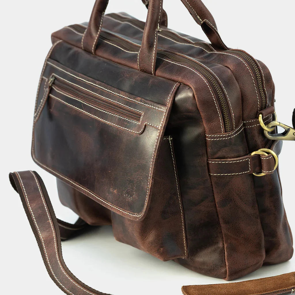 Side angle of premium leather work bag showcasing durable construction and business-ready design.