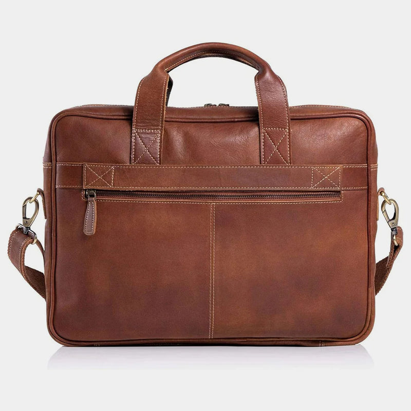 Brown leather briefcase with shoulder strap on a white background