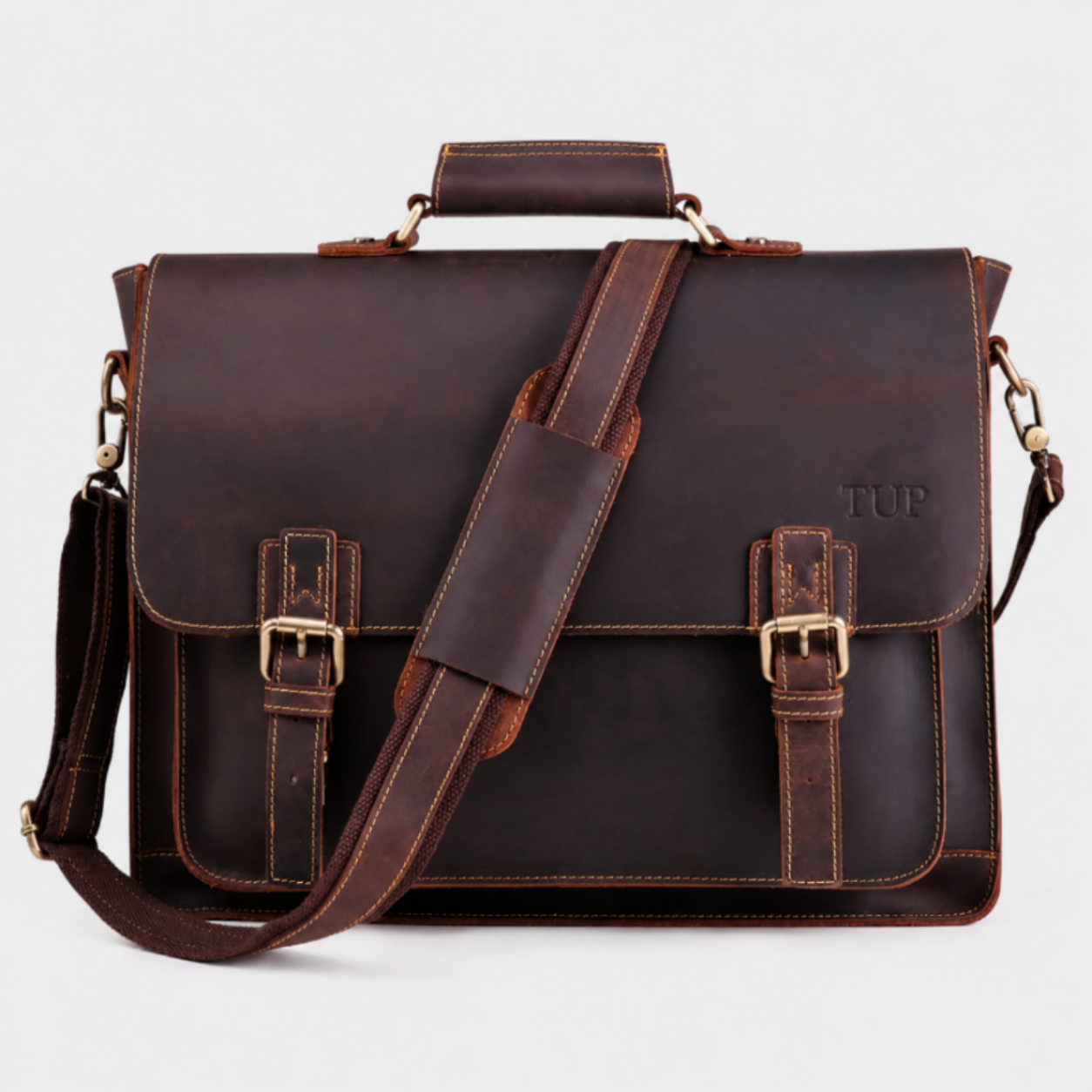 Premium brown leather messenger bag with buckle closure and adjustable shoulder strap for business professionals.