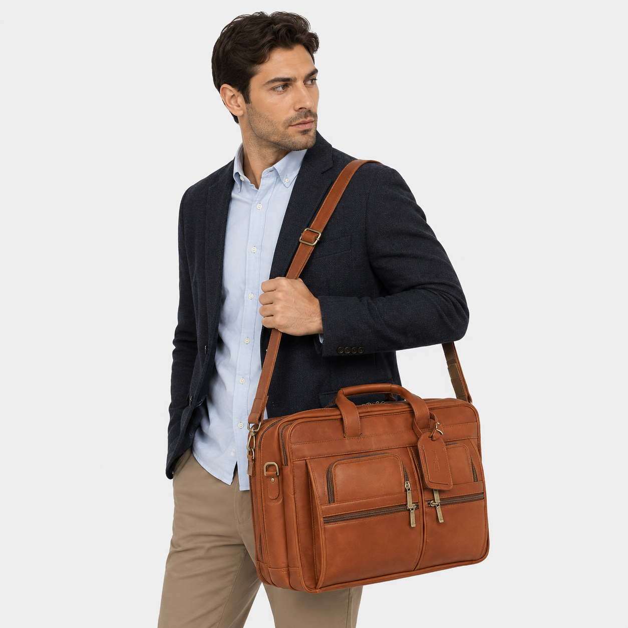 Professional carrying the Aldridge leather messenger bag for office and business travel.
