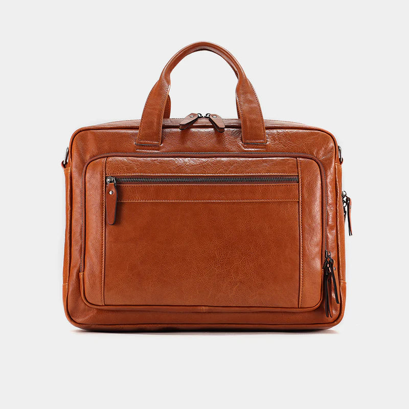 Back view of premium leather messenger bag featuring luggage sleeve and structured design.