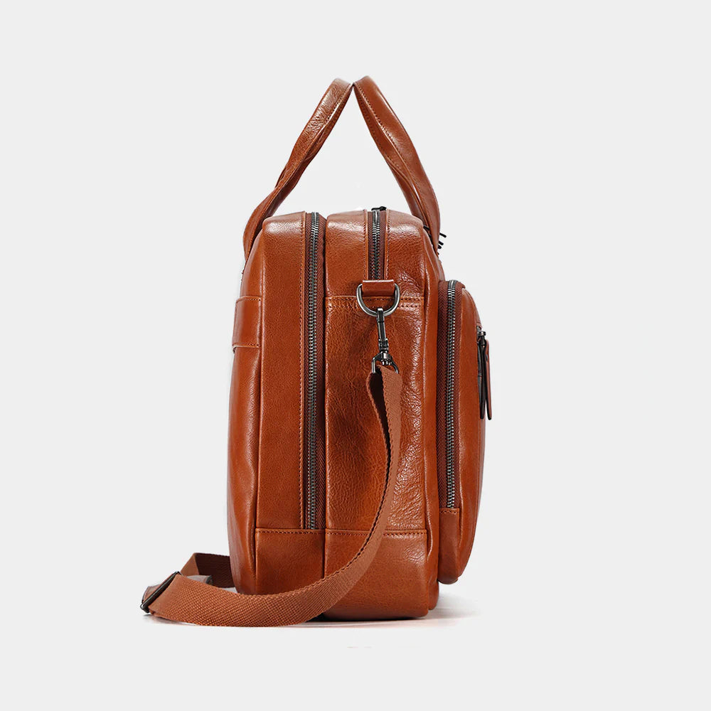 Side profile of handcrafted leather messenger bag showcasing premium craftsmanship and durable construction.