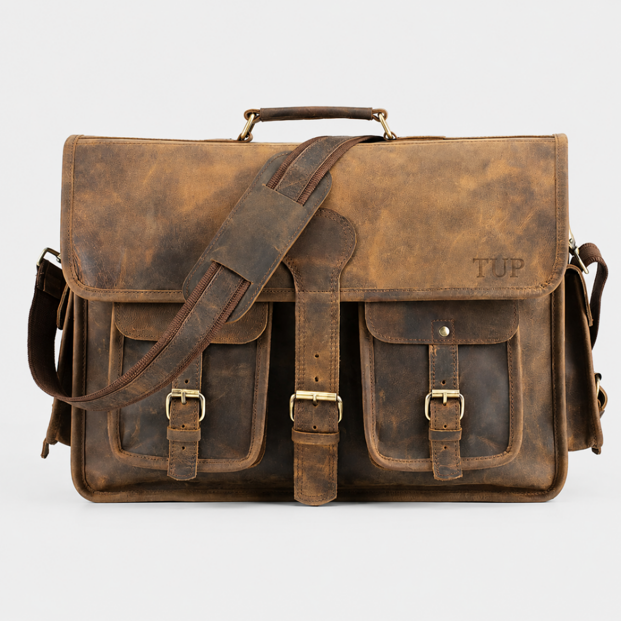 Premium brown leather messenger bag handcrafted from full-grain leather with adjustable shoulder strap for work and travel.