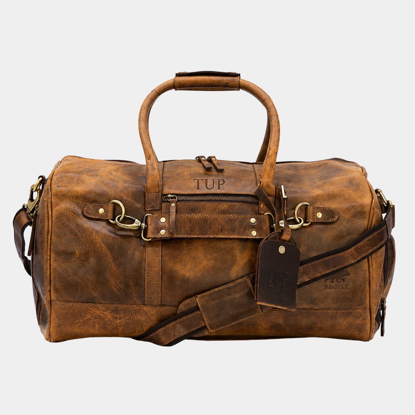 Denali 45L full grain leather duffle bag in vintage brown with luggage tag and premium brass hardware