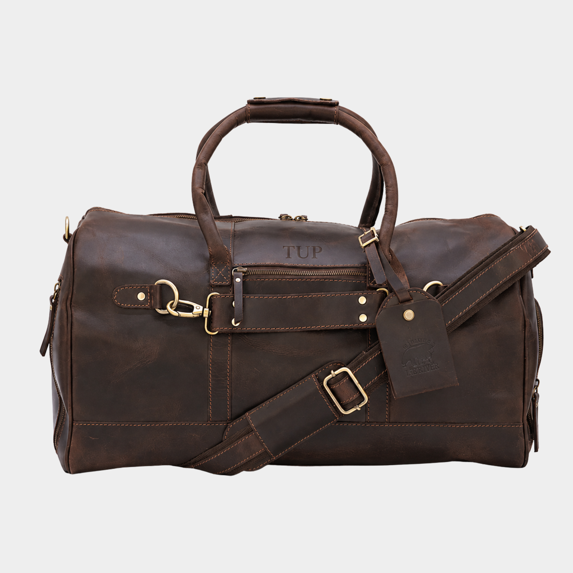 Brown leather travel duffle bag handcrafted from premium full grain leather with adjustable shoulder strap