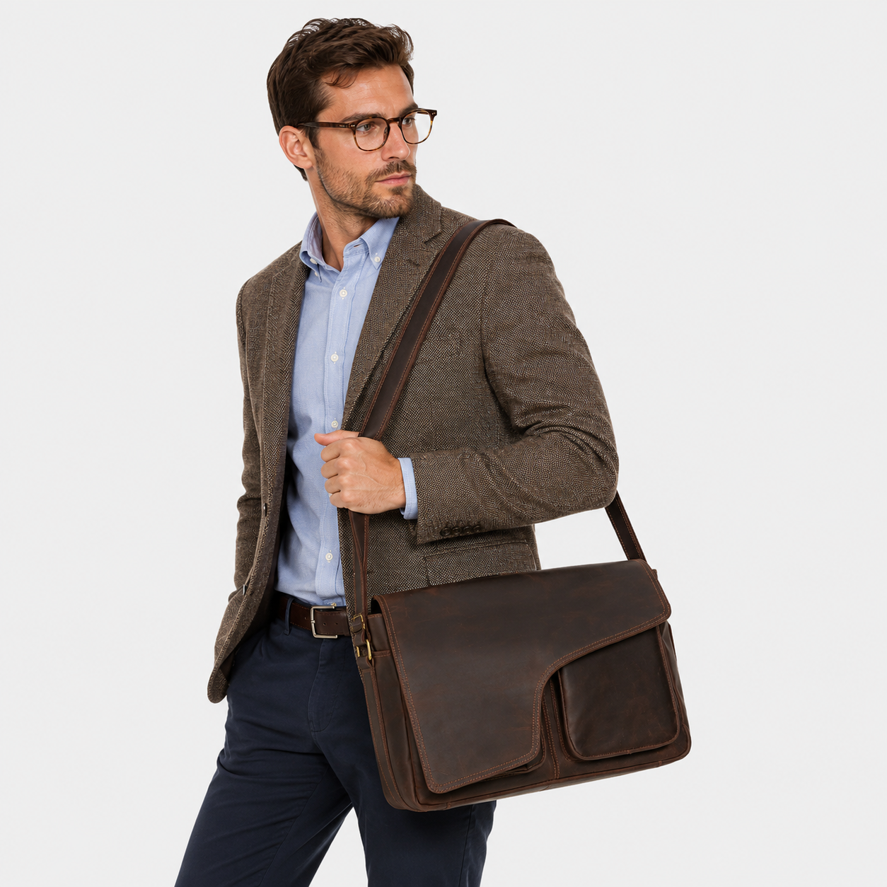 Business professional wearing the Ellery leather messenger bag crossbody.