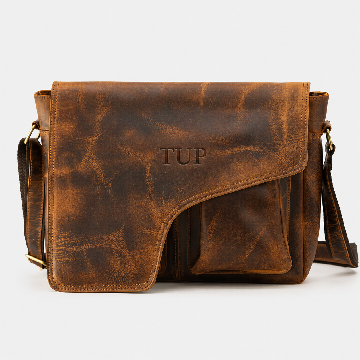 Ellery premium full-grain leather messenger bag with magnetic flap closure and adjustable shoulder strap.