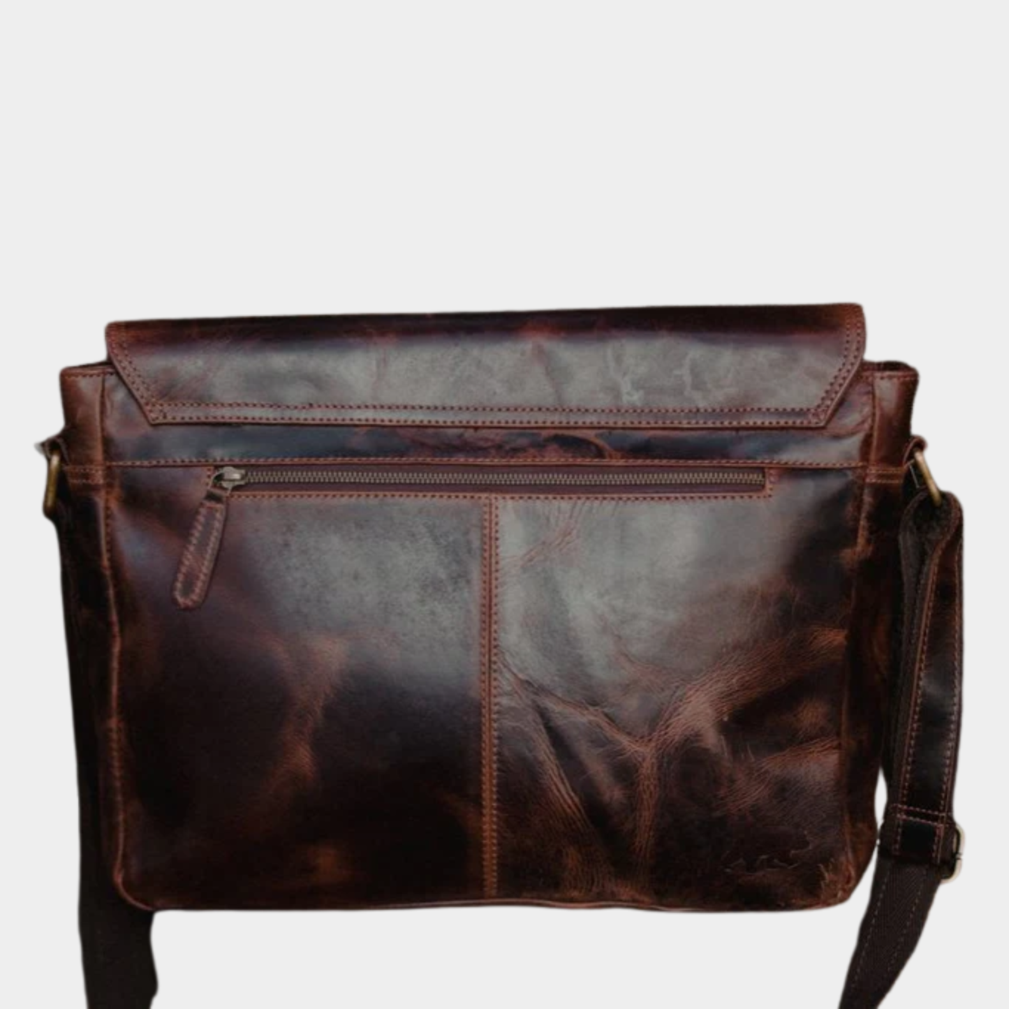 Rear compartment of premium leather messenger bag for everyday office essentials.