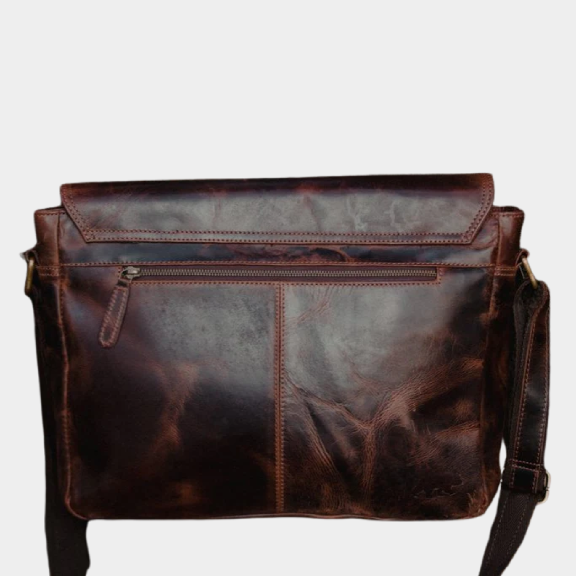 Rear compartment of premium leather messenger bag for everyday office essentials.