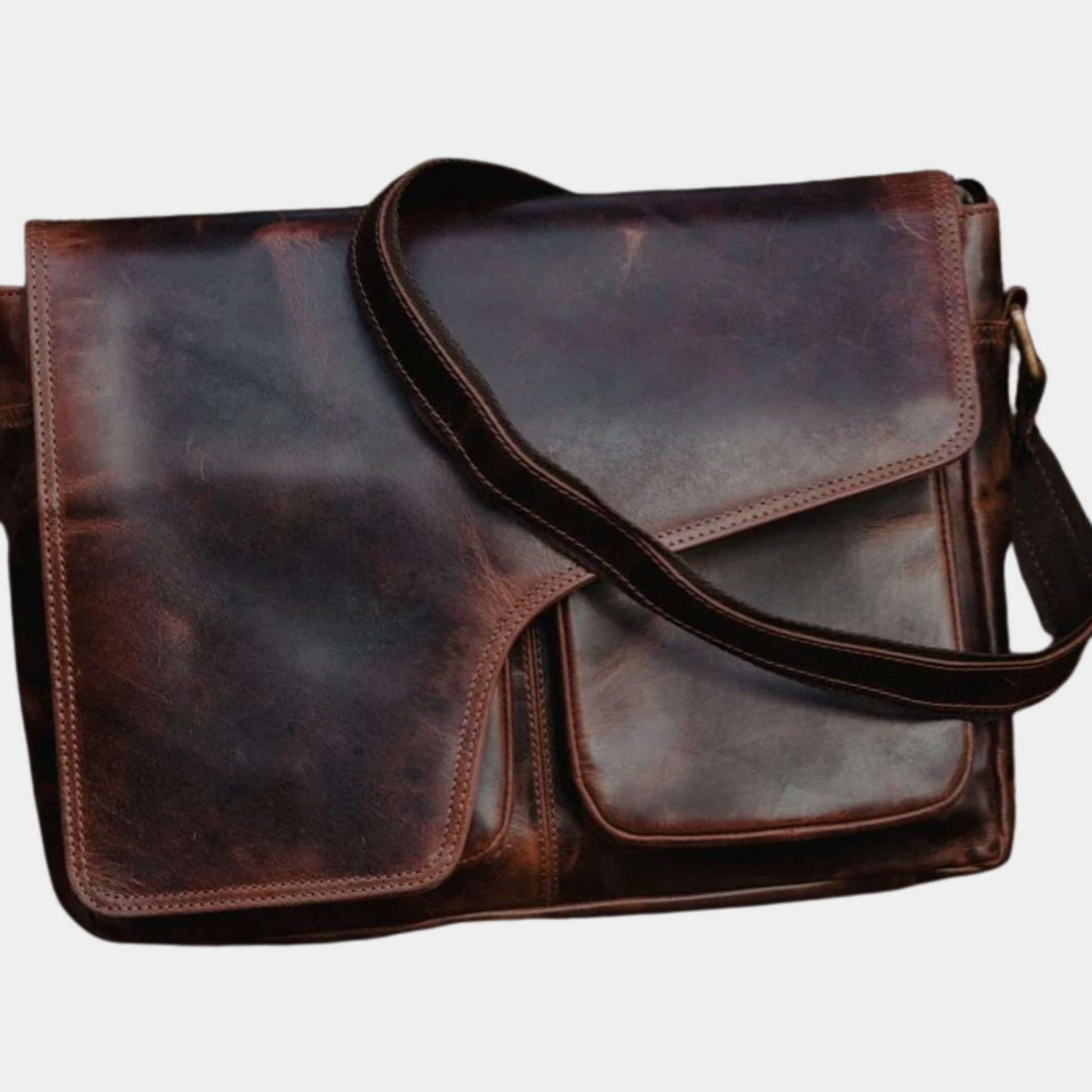 Side angle of the Ellery leather messenger bag showing slim crossbody profile.