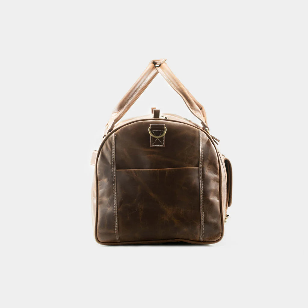 End view of premium leather travel duffle bag with reinforced handles and durable construction