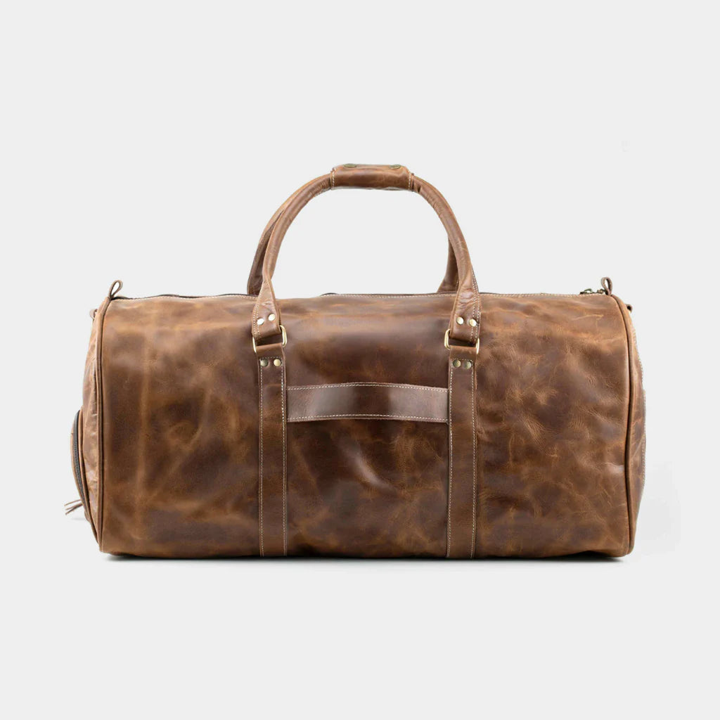 Front view of brown leather weekender travel bag handcrafted from premium cowhide leather