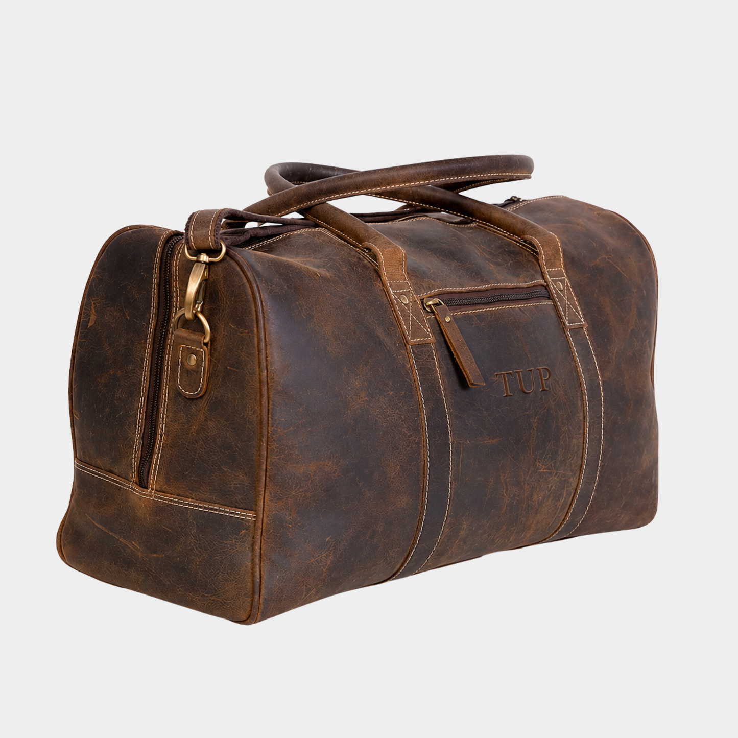 Heritage Voyager full grain buffalo leather duffle bag in vintage brown with premium brass hardware on white background