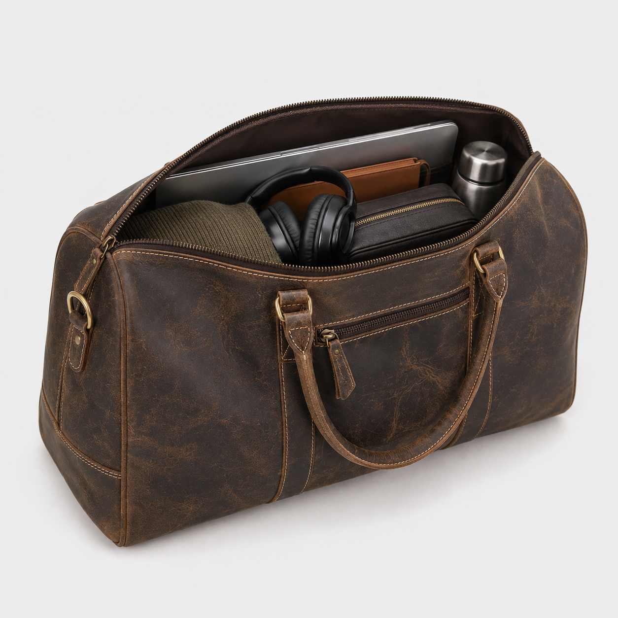 Side view of handmade brown full grain leather duffle bag with spacious storage compartment