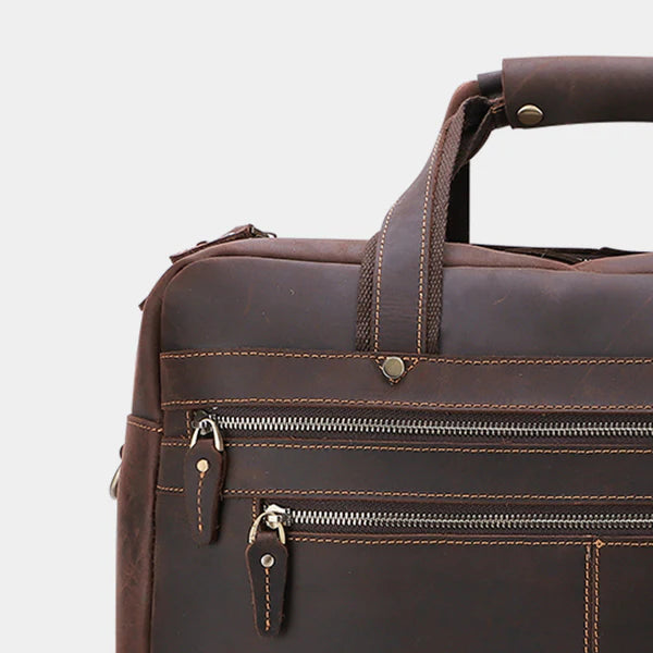 Close-up of handcrafted leather messenger bag highlighting premium stitching and durable craftsmanship.