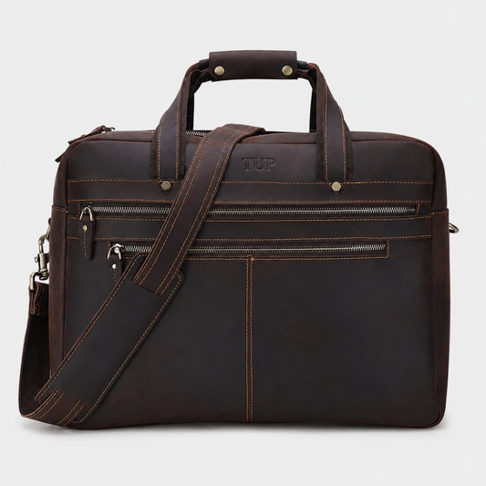 Premium brown leather messenger bag with adjustable shoulder strap and multiple zip compartments for work and business travel.