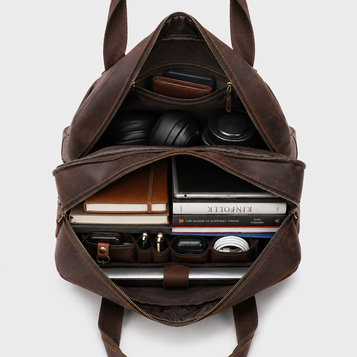 Interior of leather messenger bag with padded laptop sleeve and spacious organizer compartments.