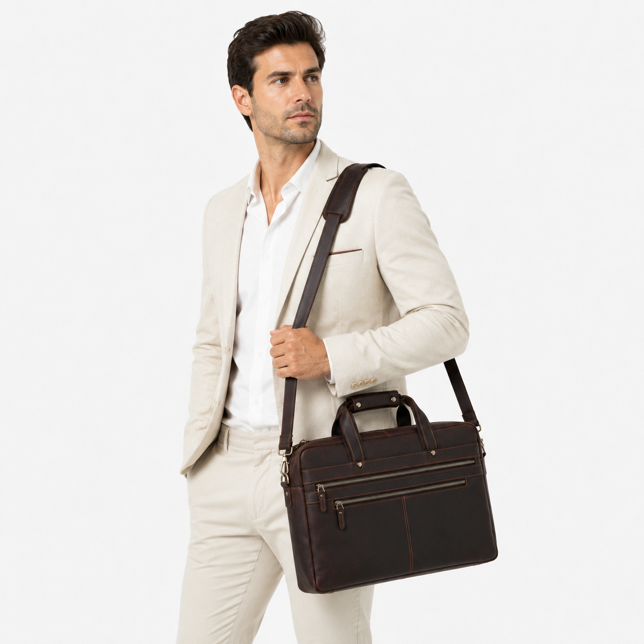 Professional carrying a premium leather messenger bag for office meetings and business travel.