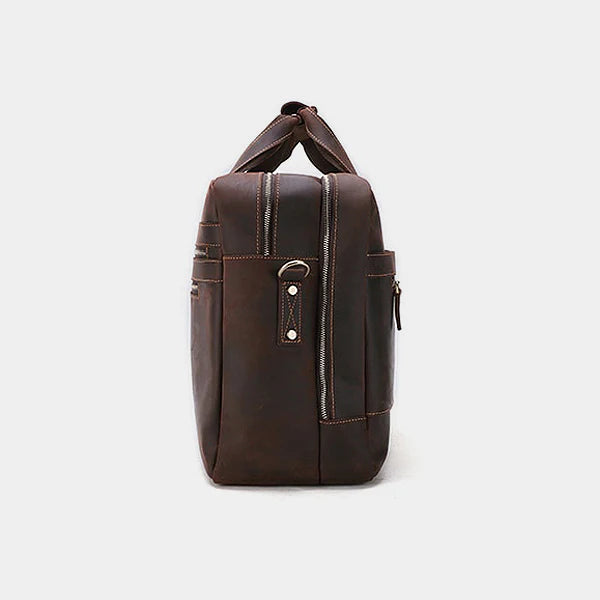 Side profile of leather messenger bag showing slim design and premium full-grain leather finish.