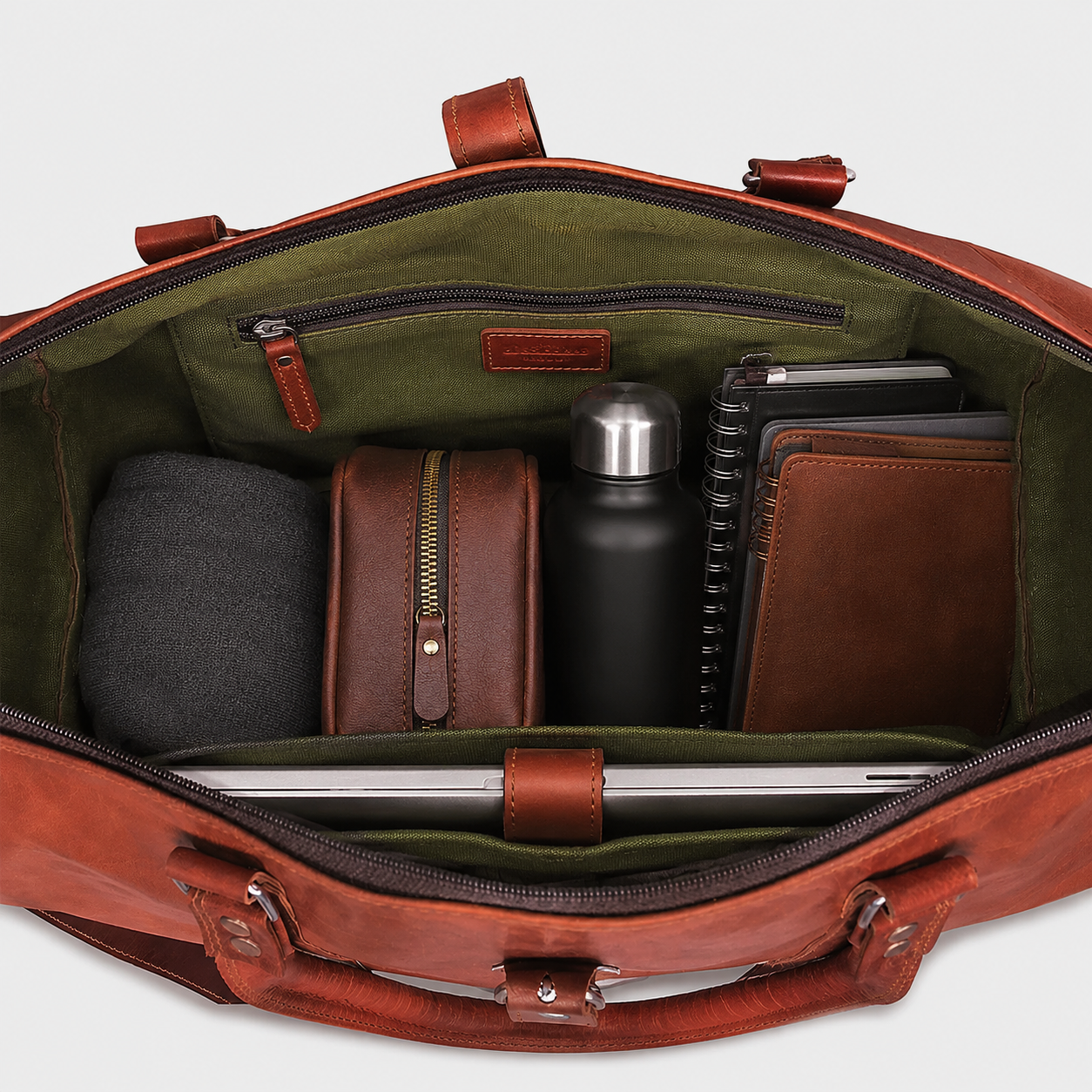 Interior view of full grain leather travel bag showing spacious storage compartments