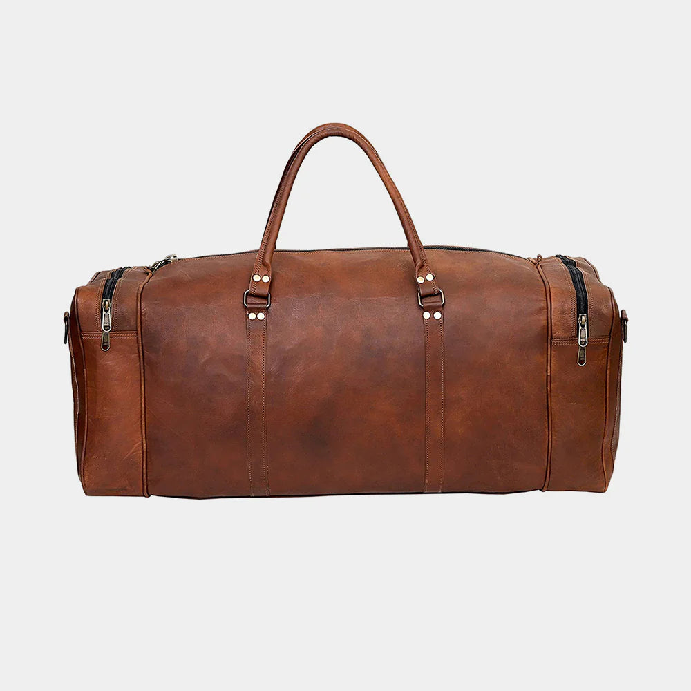 Side profile of handmade buffalo leather duffle bag with brass hardware