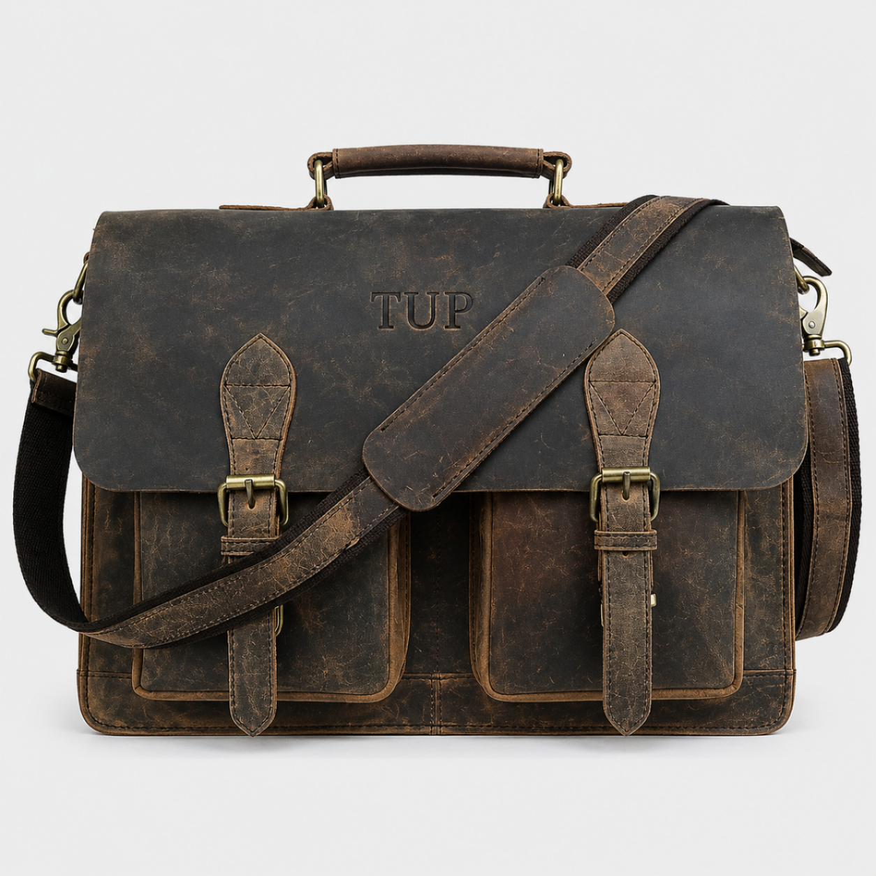 Vintage full-grain buffalo leather messenger bag with buckle flap closure and adjustable shoulder strap.