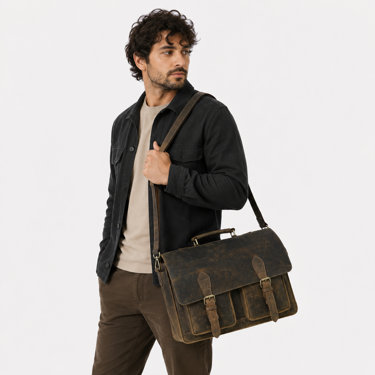 Professional carrying a handcrafted vintage leather messenger bag for business and travel.
