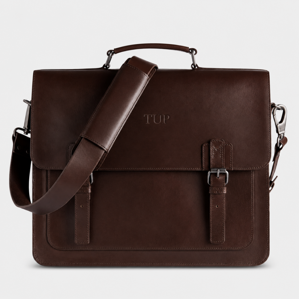 Premium brown leather briefcase handcrafted from full-grain buffalo leather with adjustable shoulder strap for business professionals.
