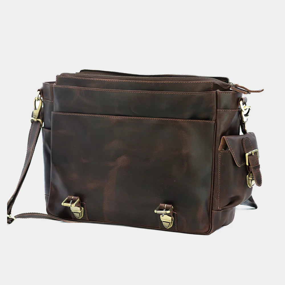 Lifestyle image of brown leather messenger bag for everyday office use.