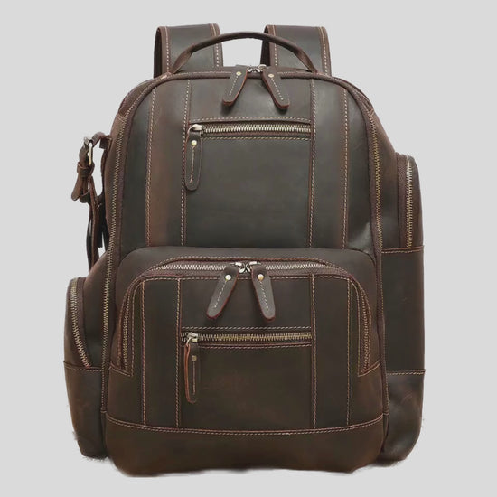 Open view of The Atlas backpack displaying spacious compartments and organized storage