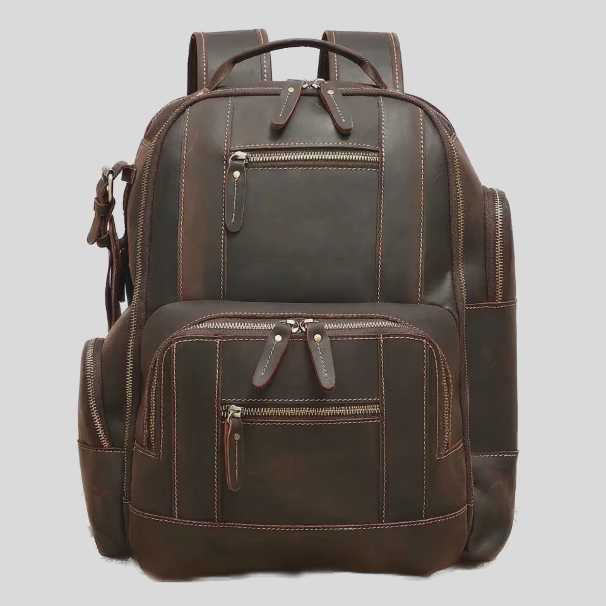 Open view of The Atlas backpack displaying spacious compartments and organized storage