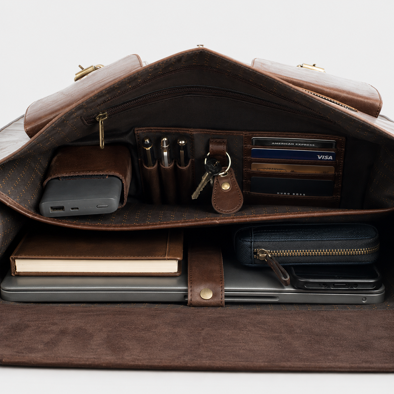 Interior compartments of premium leather messenger bag with dedicated laptop sleeve and organizer pockets.