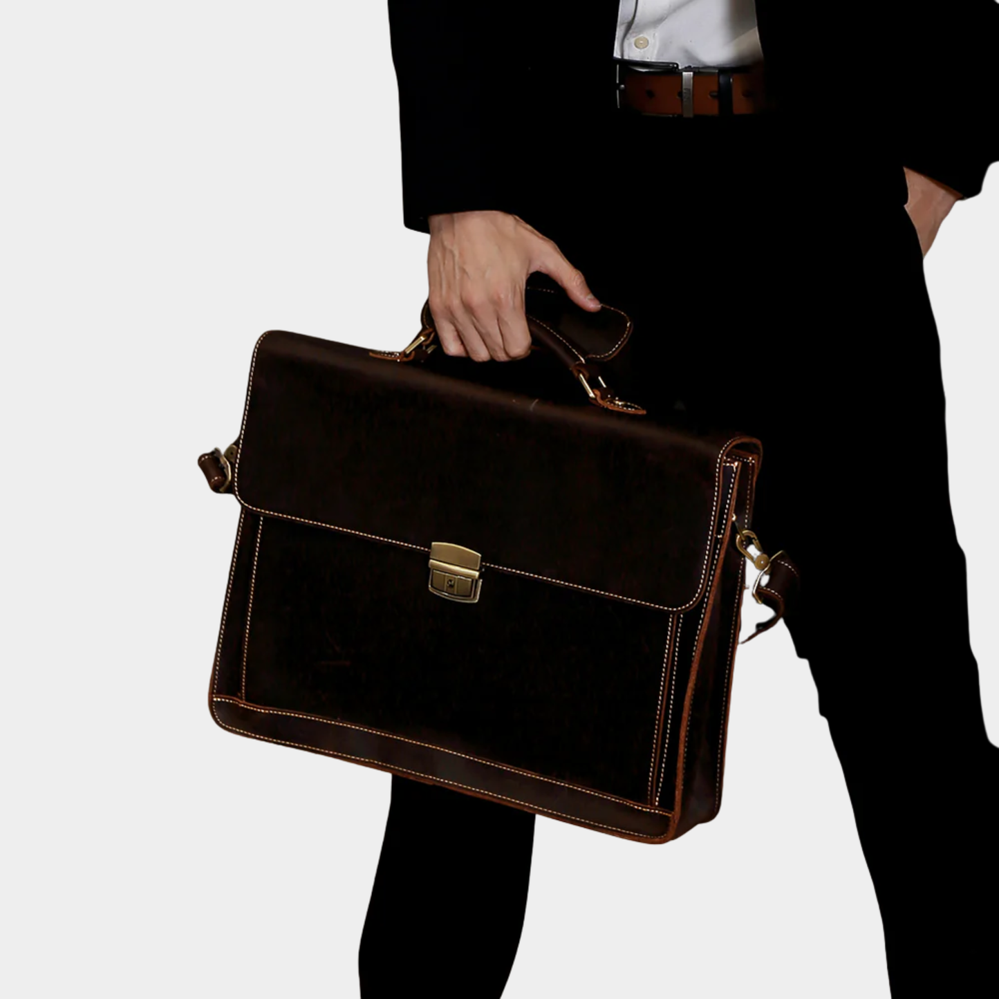 Professional carrying the Rothwell leather briefcase for office and business meetings.
