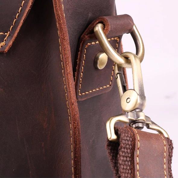 Close-up of premium leather shoulder strap and brass hardware on the Rothwell briefcase.