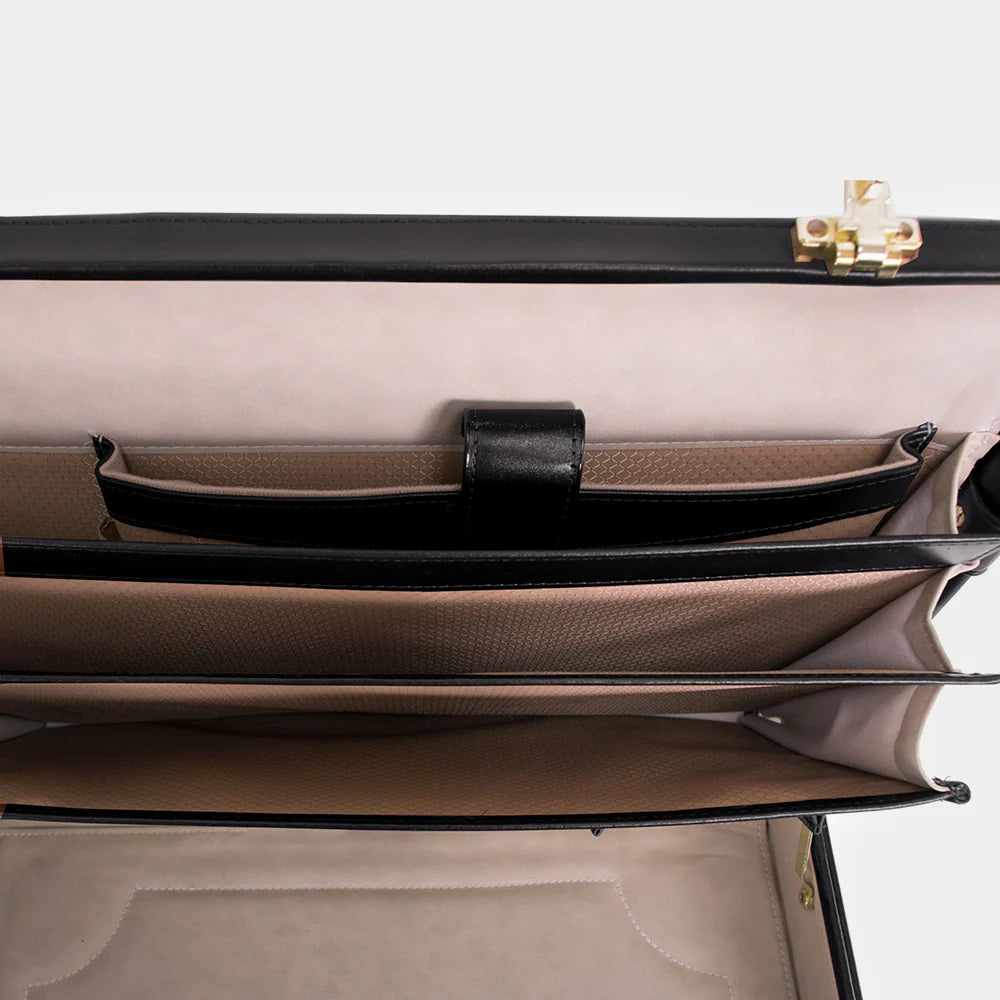 Premium metal lock detail on The Sovereign luxury leather briefcase.