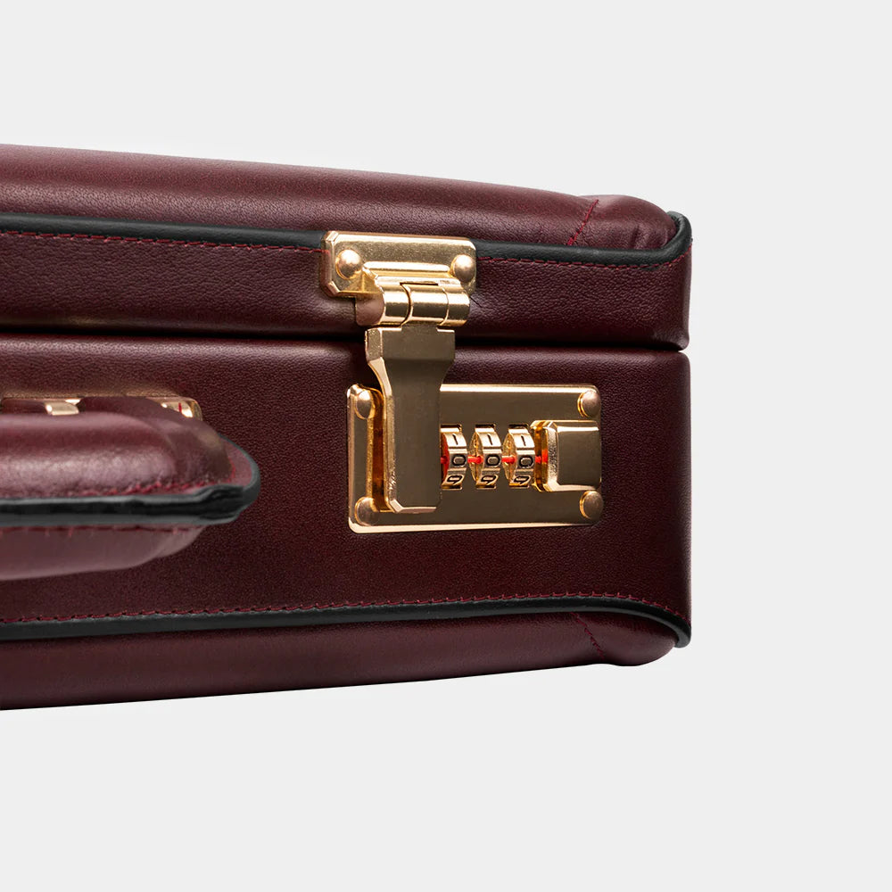 Premium metal lock detail on The Sovereign luxury leather briefcase.