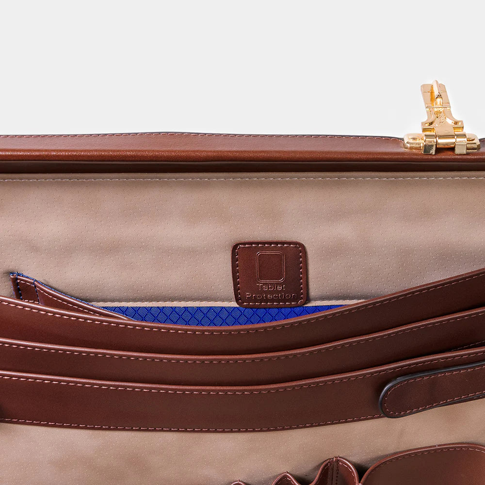 Premium metal lock detail on The Sovereign luxury leather briefcase.