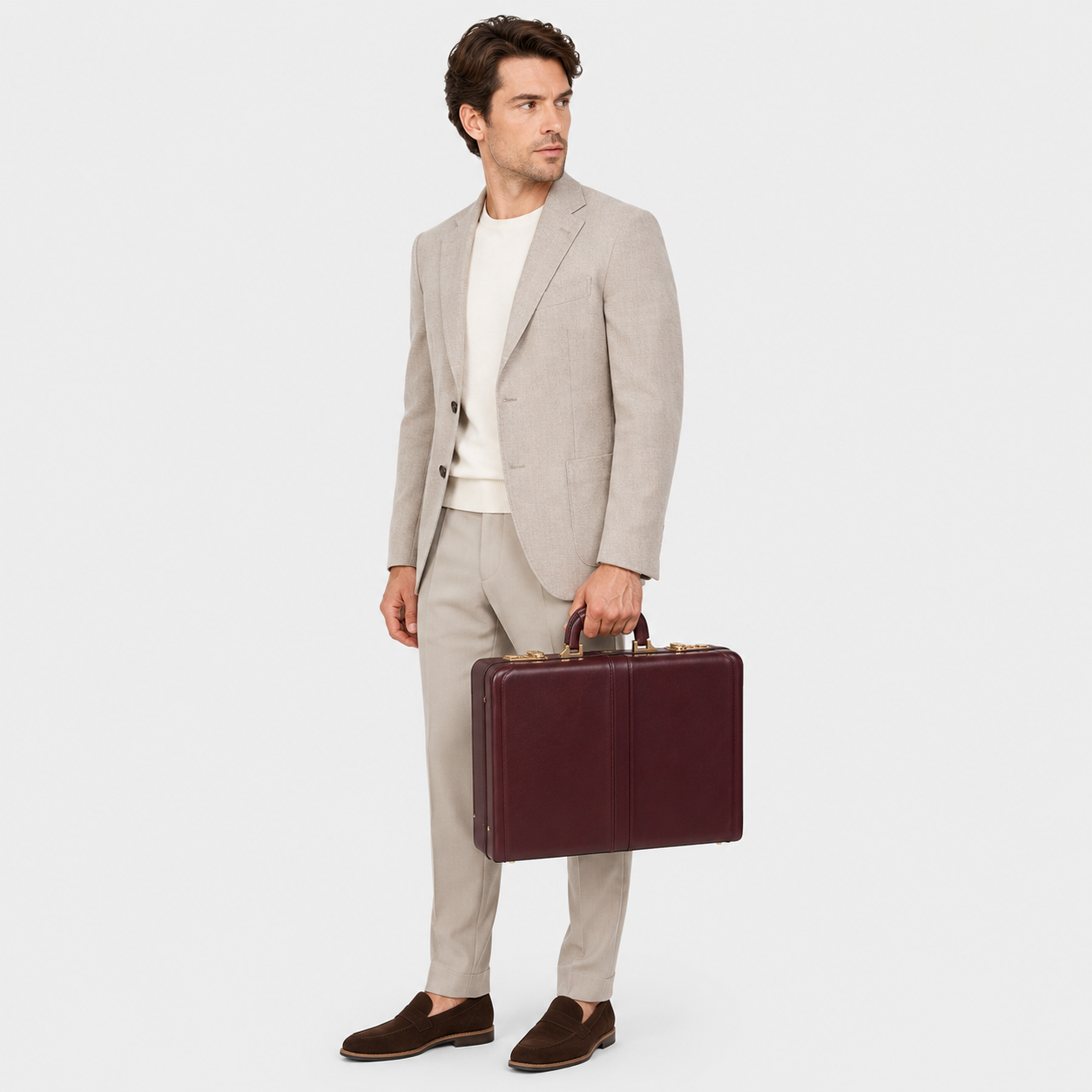 Executive carrying The Sovereign leather briefcase during business travel.