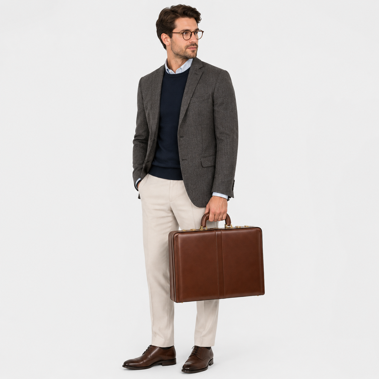 Executive carrying The Sovereign leather briefcase during business travel.