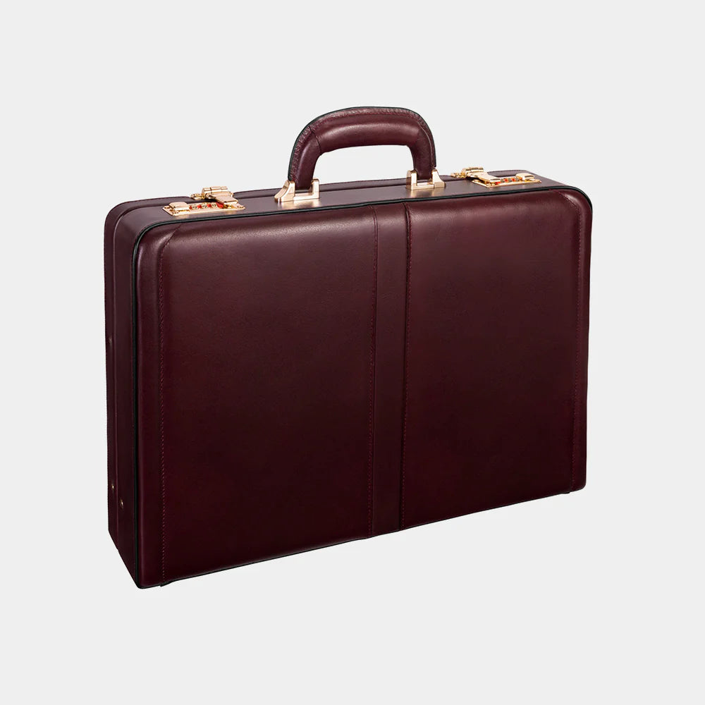 Brown leather briefcase on a light gray background