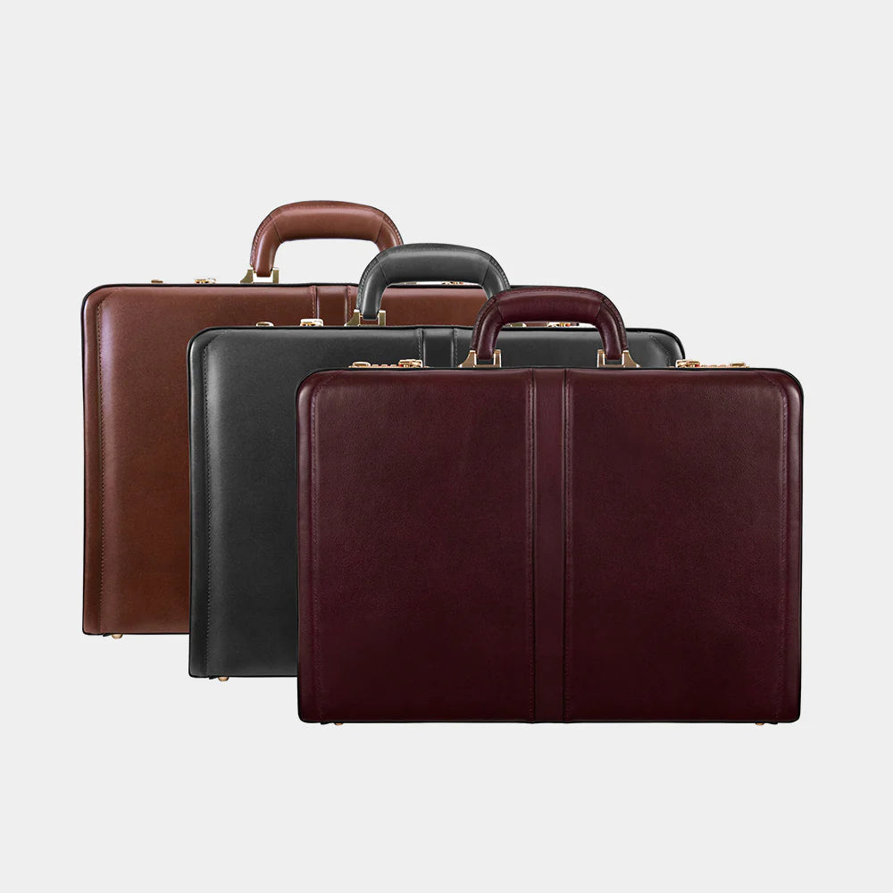 Set of leather briefcases in light brown, dark brown, and black background