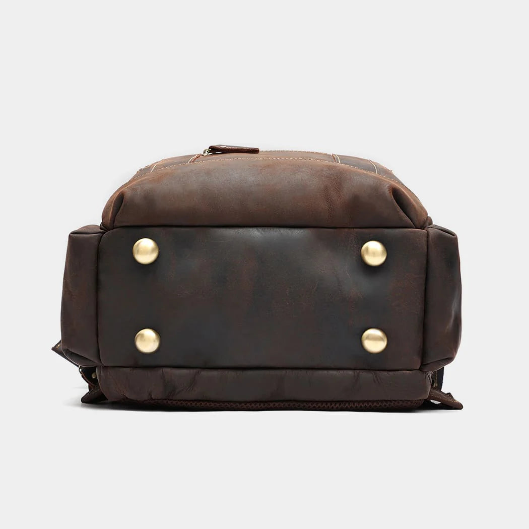 Leather backpack attached to rolling luggage using rear luggage strap