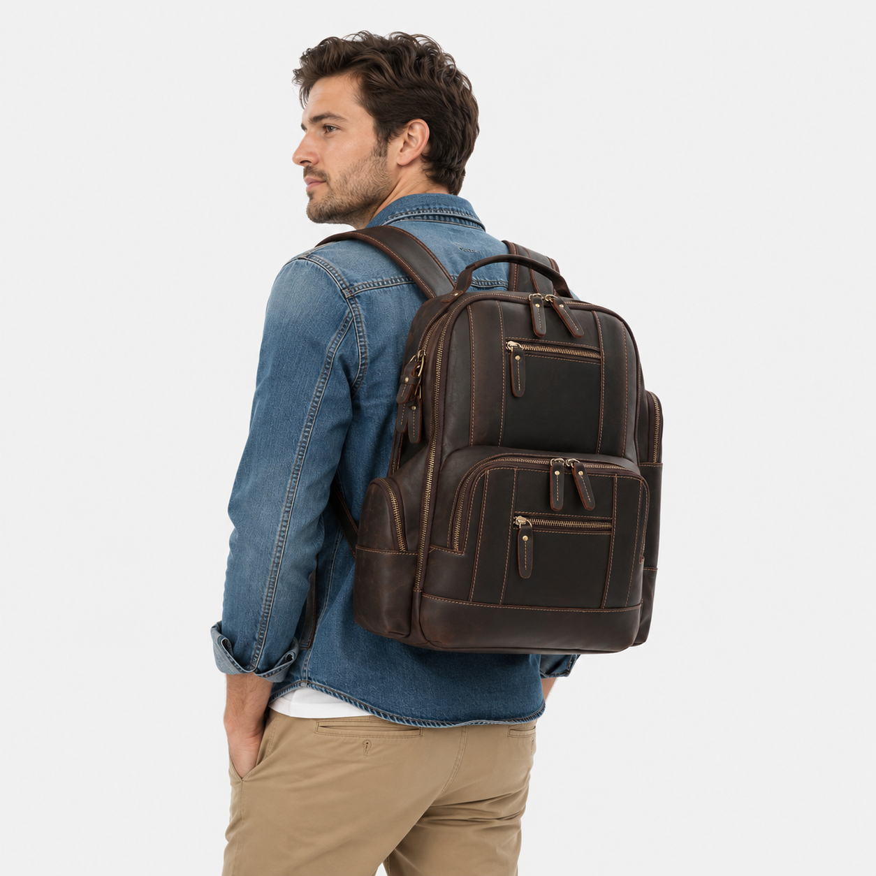 Lifestyle image of a professional carrying The Atlas leather backpack while commuting