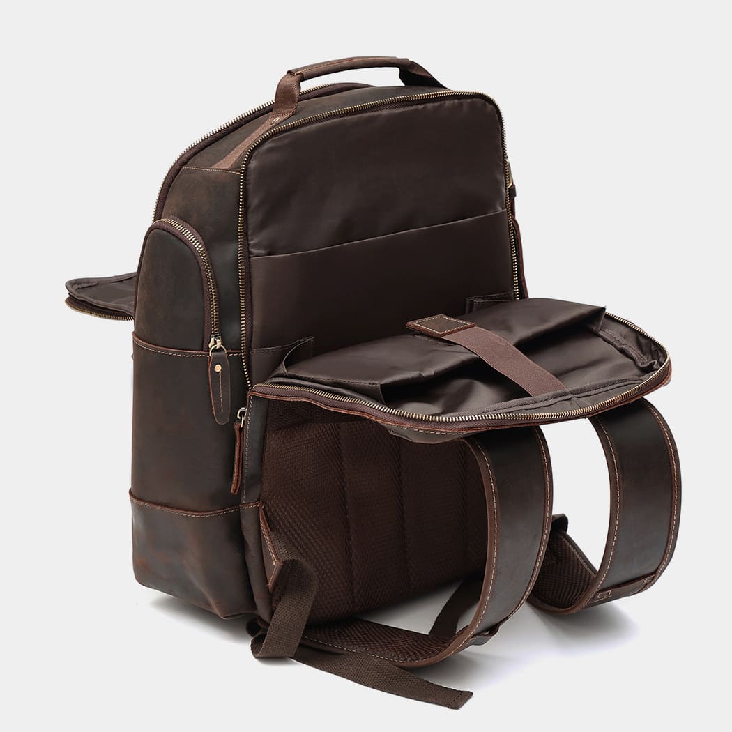 Open view of The Atlas backpack displaying spacious compartments and organized storage