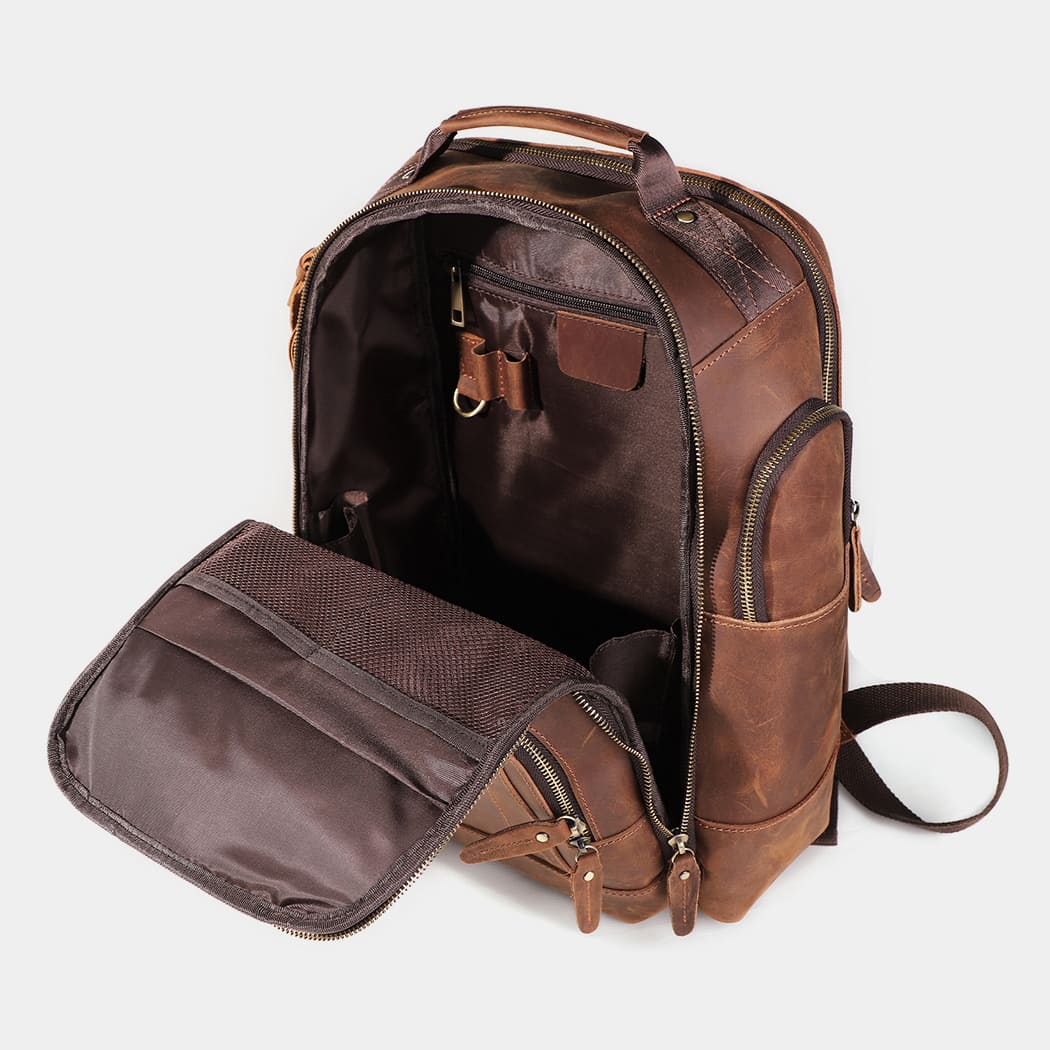 Open view of The Atlas backpack displaying spacious compartments and organized storage