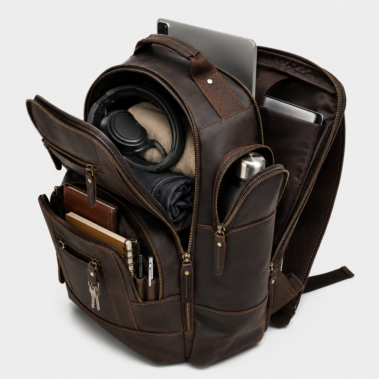 Interior of premium leather backpack showing padded 16-inch laptop compartment and organizer pockets