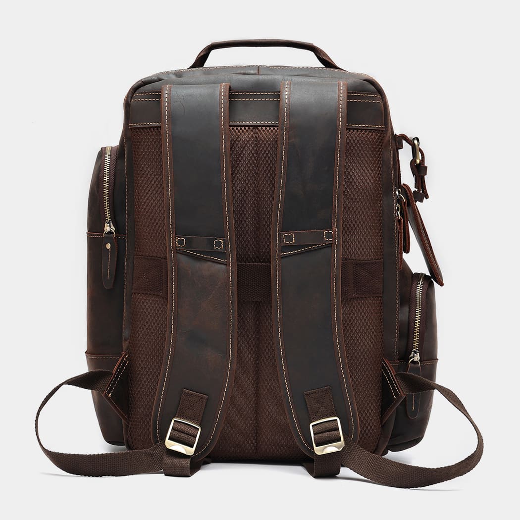 Leather backpack attached to rolling luggage using rear luggage strap